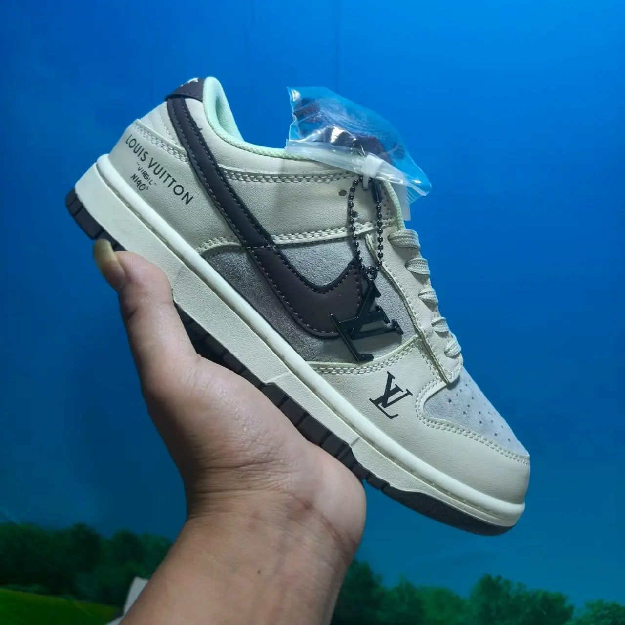 Suede leather hybrid retro casual trainers built for versatile calm warm muted all-season minimalist vintage street fashion aesthetics, dense soft off-white smooth leather shell layered with light gray suede panels and dark brown leather overlays