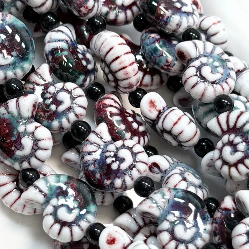 M11. Ceramic Seashells 1 String