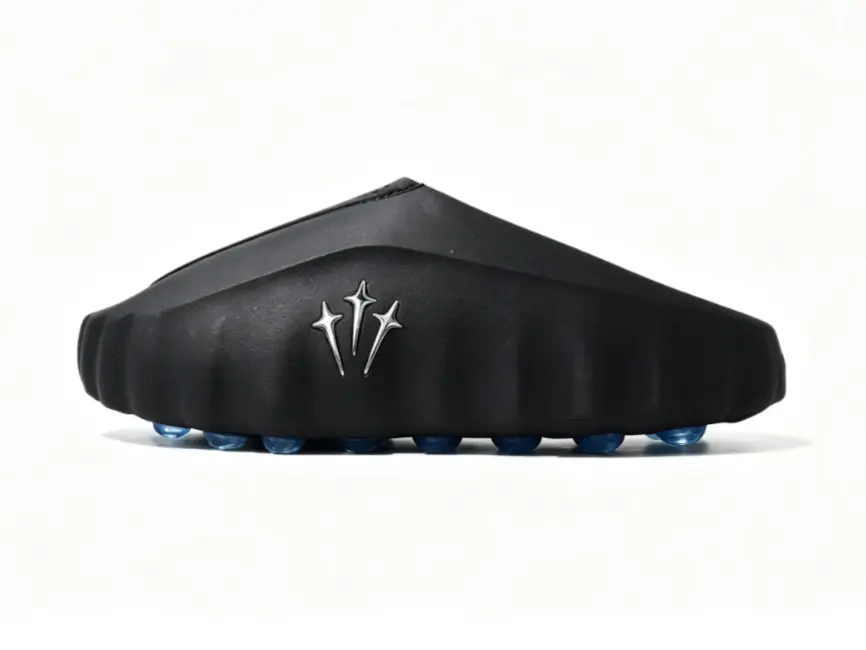 solid black thick sole massage slides royal blue spherical bump outsole breathable fabric upper pre game recovery tech mules