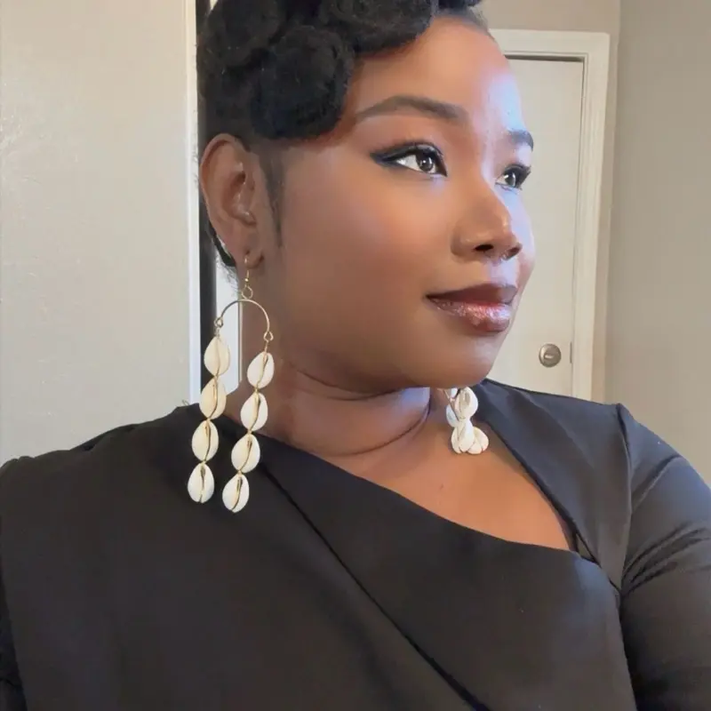 27/BALANCE:Afrocentric handmade natural cowries designs earrings.These earrings are crafted by West African artisans. They showcase and celebrate  beauty and heritage.