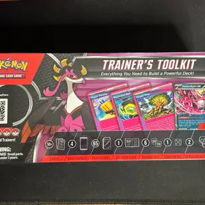 Pokémon Trainer's Toolkit 2025 Box - Includes 4 Booster Packs, 65 Sleeves, Dice AND MORE