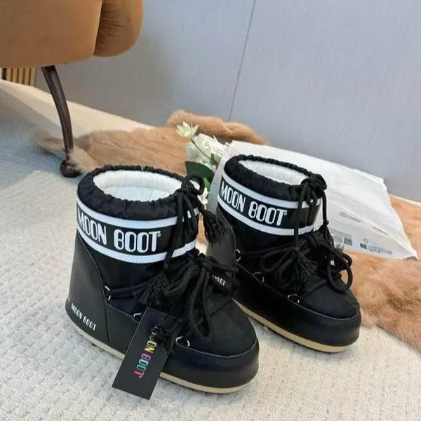 Moon Boot Black Winter Boots with "Moon Boot" Logo and Lace-Up Design for Cold Weather