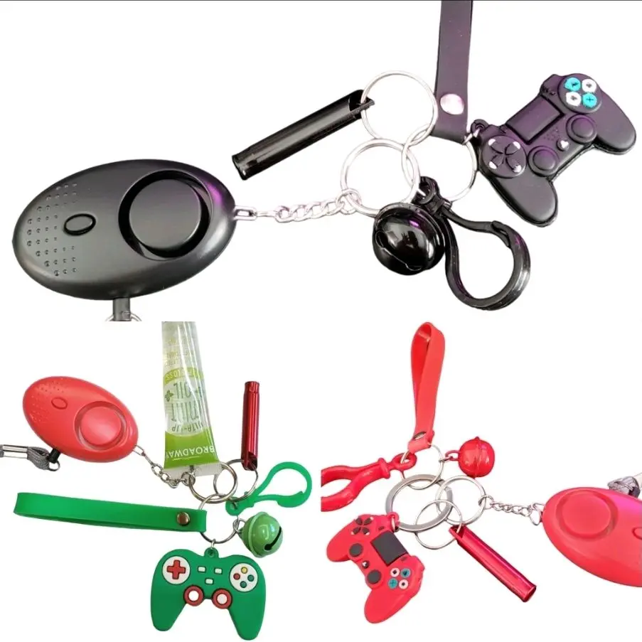 Green, Red or Black Gamer Kids Safety Keychains   - Game Controller  Charm Keychains   - Wristlet w/Clip  - Whistle   - Alarm Siren   - Lip Gloss (Random Flavor)   