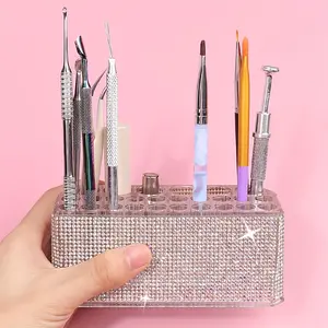 A minimalist and stylish 26-hole diamond-studded luxury acrylic makeup brush holder—perfect for storing nail brushes, nail pens, and some tools. Multifunctional Organizer Boxes
