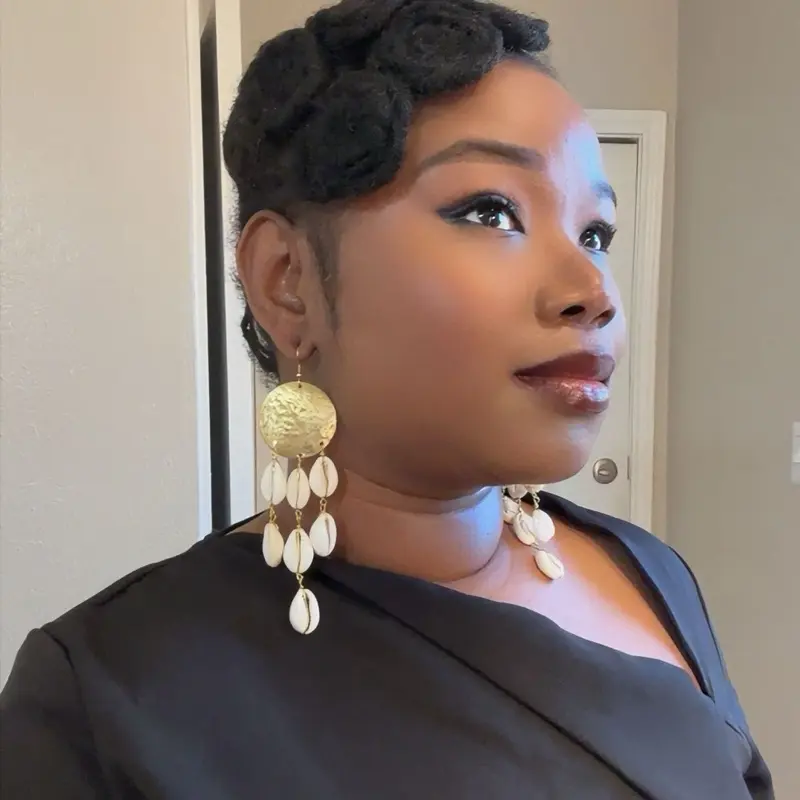 33/SUN: 100% handmade natural cowries shell earrings with an accent of Gold brass material.Crafted by west Africans jewelry artisans to boldly standout and celebrate beauty  and heritage in a fashionable way.