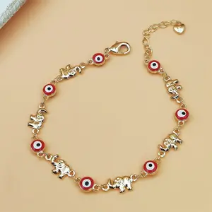Women's Bohemian Elephant Charm Bracelet Golden-Tone Chain with Red Eyes Adjustable Clasp Everyday Valentine's Jewelry Gift for Her Birthday Anniversary Present Year-Round Layered Look Elephant Jewelry Playful Design Detailed Craftsmanship