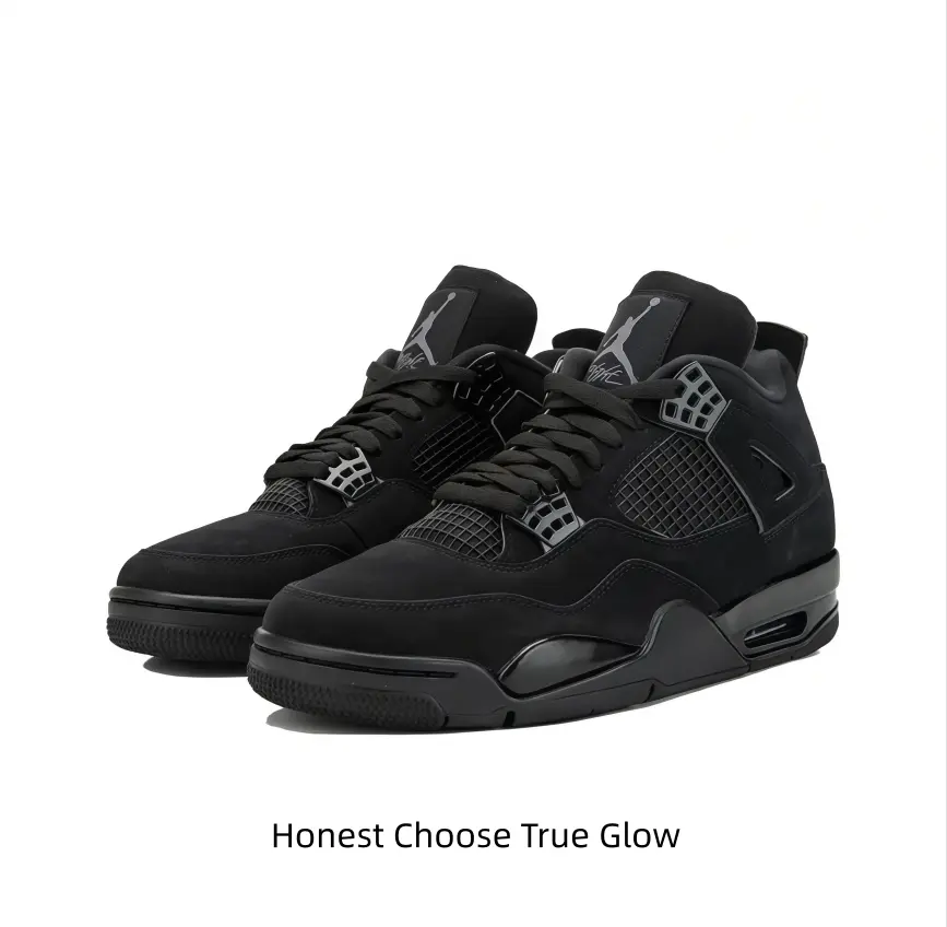 Classic matte black suede mid-top basketball shoes with breathable woven mesh cutouts and subtle grey hardware detailing, matching dark trousers and sleek monochrome seasonal fashion ensembles.