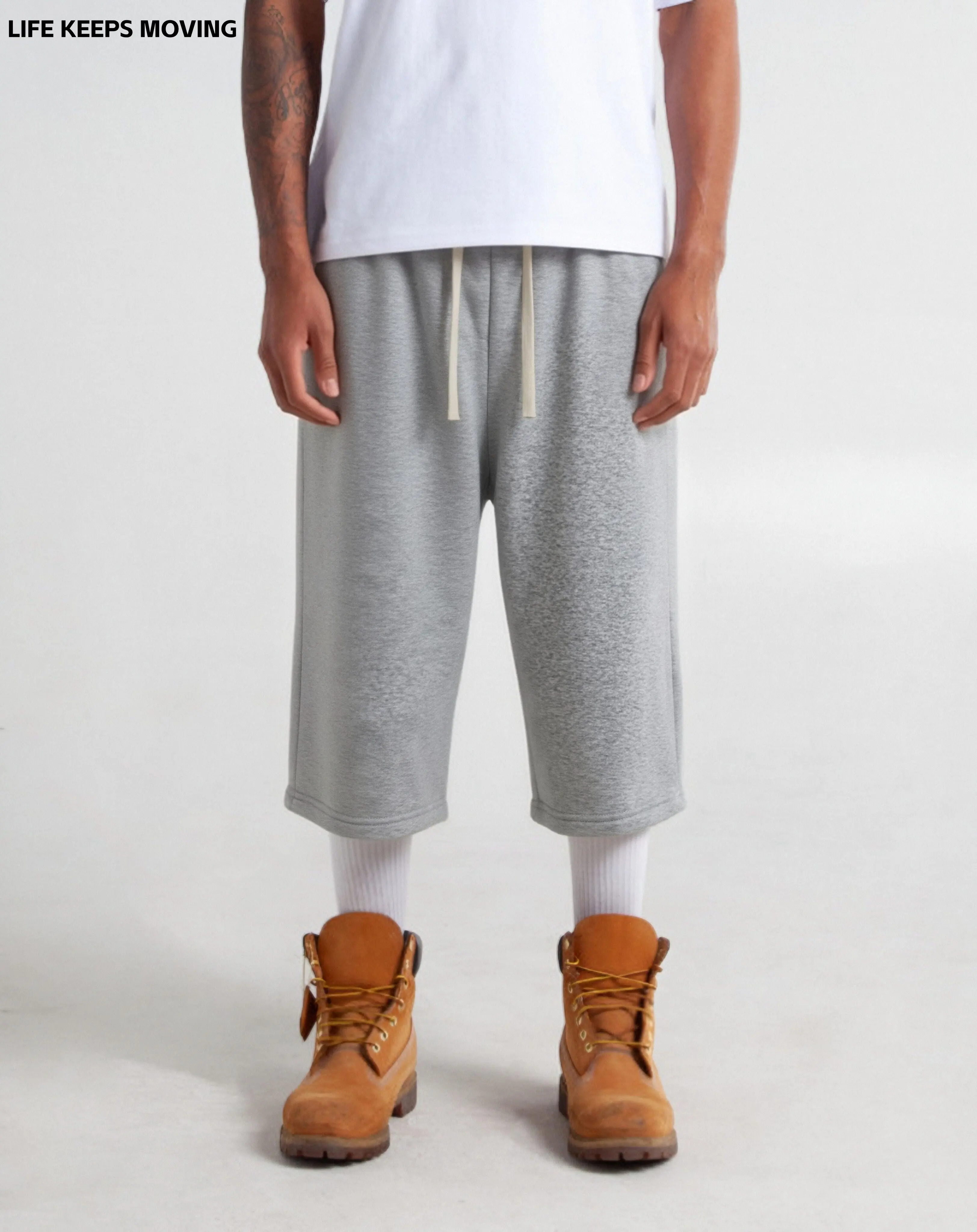 LIFE KEEPS MOVING men’s loose lightweight shorts from a fashionable streetwear brand, sporty style, suitable for outdoor wear, versatile and comfortable athletic shorts with a drawstring design