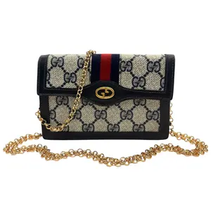 Pre-owned GUCCI coated canvas and leather Crossbody Bags Navy Coated Canvas Mini Ophidia Clutch with Detachable Gold Chain Strap & Web Stripe Details