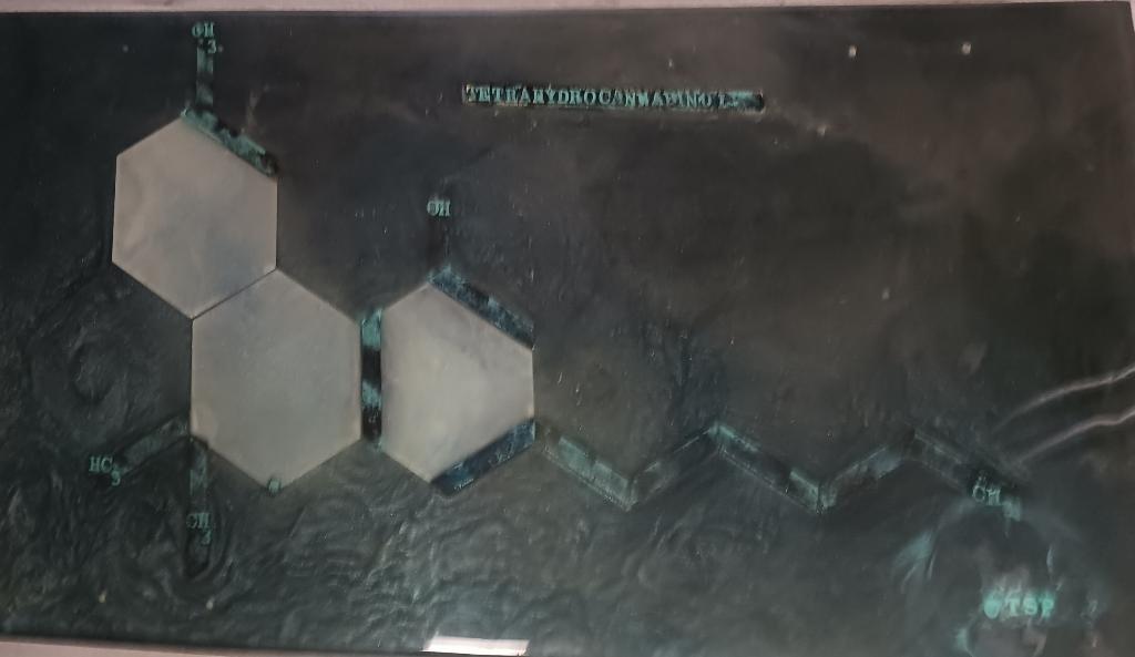 Cross Legs epoxy table featuring the tetrahydrocannabinol compound in multiple layers of epoxy providing a deep tridemtional feel