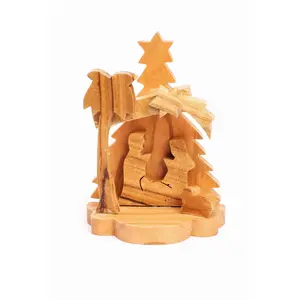 Olive Wood Nativity Scene_ Carved Grotto with Christmas Tree Background