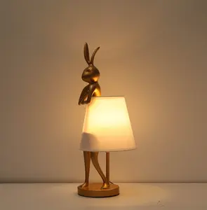 Cute Rabbit Animal Table Lamp Creative Bunny Table Lamp Gold Resin Apron LED Desk Light,White Linen Shade 15.7inch, Home Decor Eye Protection ​Lamp Office Study Bedside Lamp