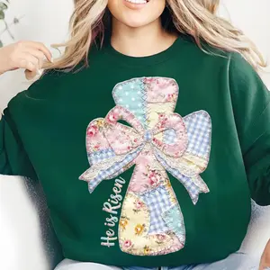 He Is Risen Cross Sweatshirt - Patchwork Fabric Style Cross With Floral Bow And “He Is Risen” Vertical Lettering Graphic , Christian Easter Theme , Crewneck Sweatshirt , Cozy Soft Fabric , Faith Based Apparel , Gift For Believers Casual