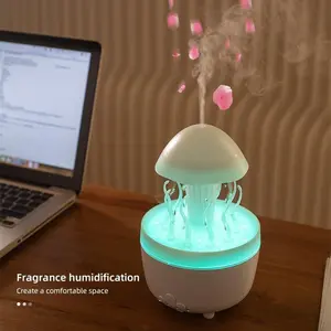 Home rotating raindrop aroma diffuser with colored night light, desktop mushroom and aquatic plant air humidifier with remote control.