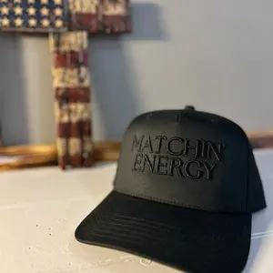 Matchin Energy Black on black trucker hat