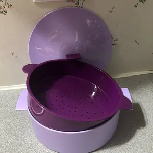 Round food storage container with lid and strainer, ideal for tortillas or other foods