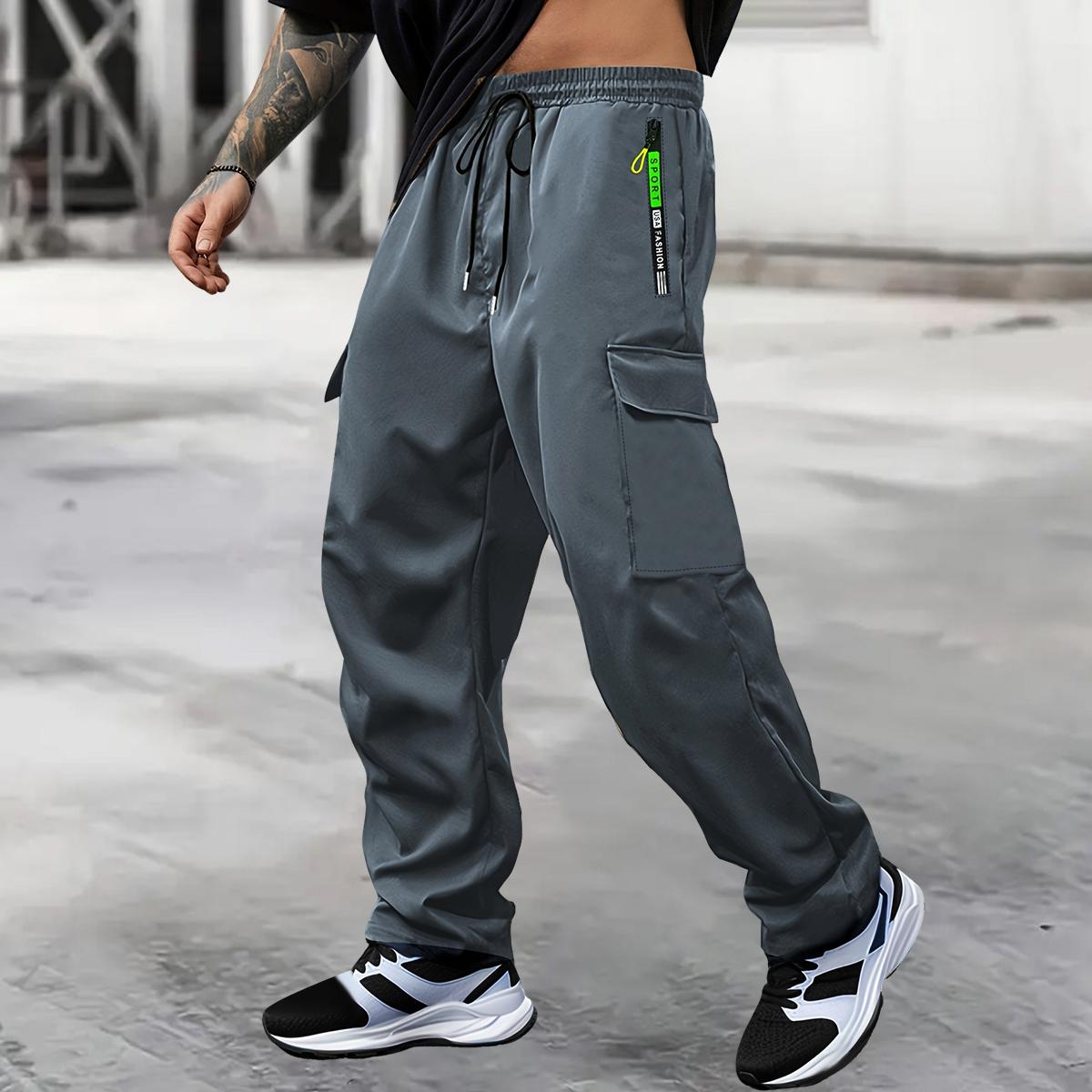 Men's spring-autumn style letter green zipper pocket work pants with fashionable large patch pocket design with drawstring elastic waist, suitable for jogging, hiking and daily wear. Valentine's Day gift.