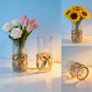 One glass vase and a gold bow home decor item, suitable for Christmas and holiday decoration in family living rooms and studies. A perfect gift choice that suits modern homes for versatile placement and enhances the home’s atmosphere.