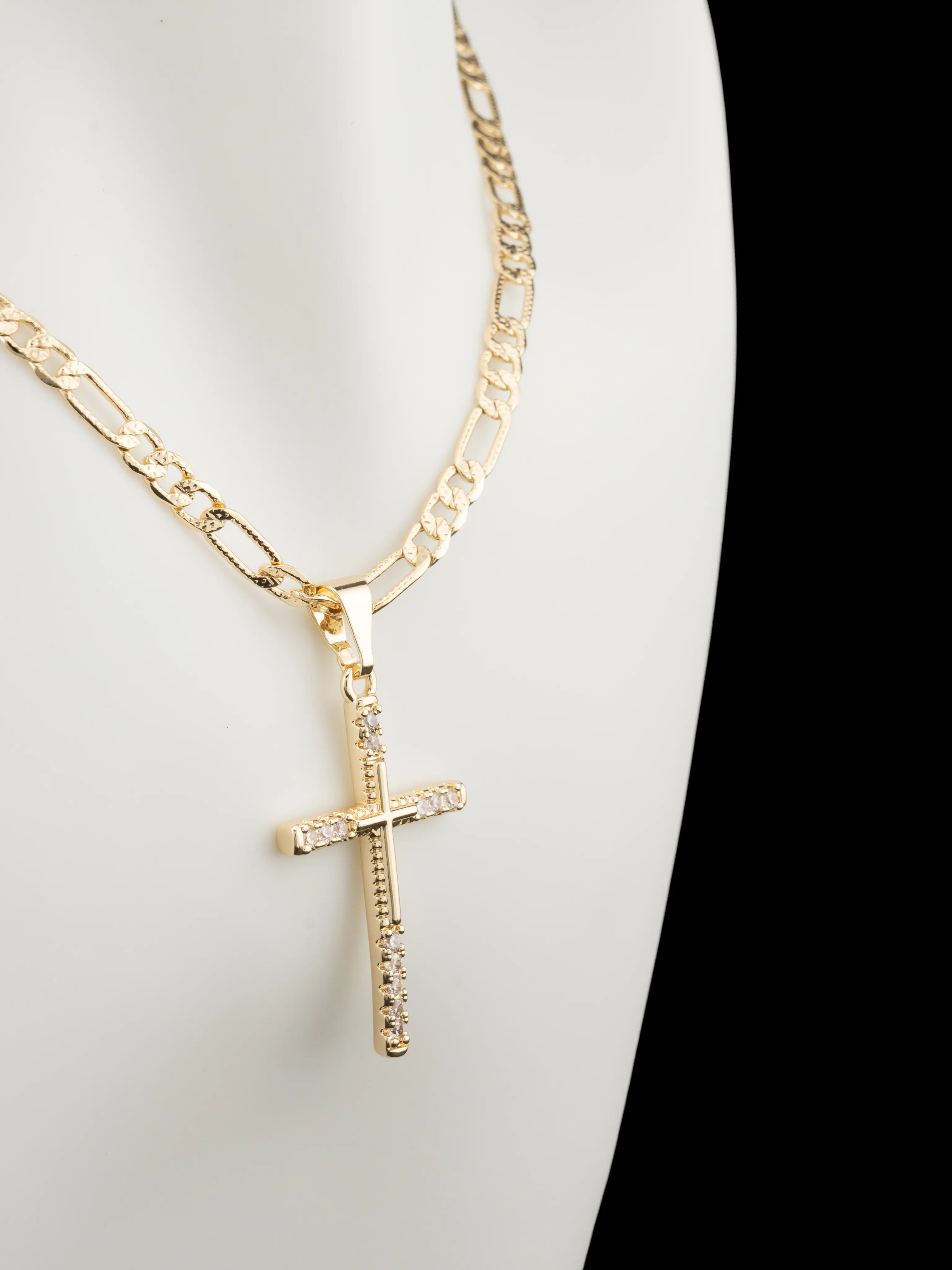Beautiful small cross in gold plating with clear stones, includes a beautifully designed chain in 18 or 24 inches.
