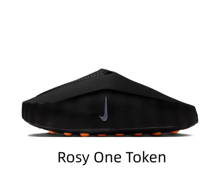 Sleek all-black hollow slip-on as core piece for neutral dark casual fits. Matte foam upper paired with hidden orange outsole creates understated contrast. It matches dark sportswear for minimalist cool street photoshoots.