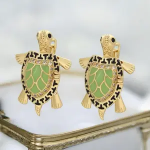 Aretes 645 estilo tortuga Gold plated