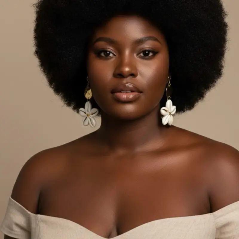 23/ FLOWER: 100% handmade natural cowries shell earrings with an accent of Gold brass material.Crafted by west Africans jewelry artisans to boldly standout and celebrate beauty  and heritage in a fashionable way.