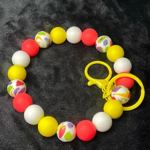 Wristlet/keychain wristlet message with custom order