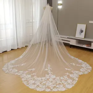 A fan-shaped wedding veil with full-width floral lace trim.