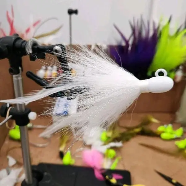 All white custom bucktail on bullet jig. All white custom bucktail on bullet jig.