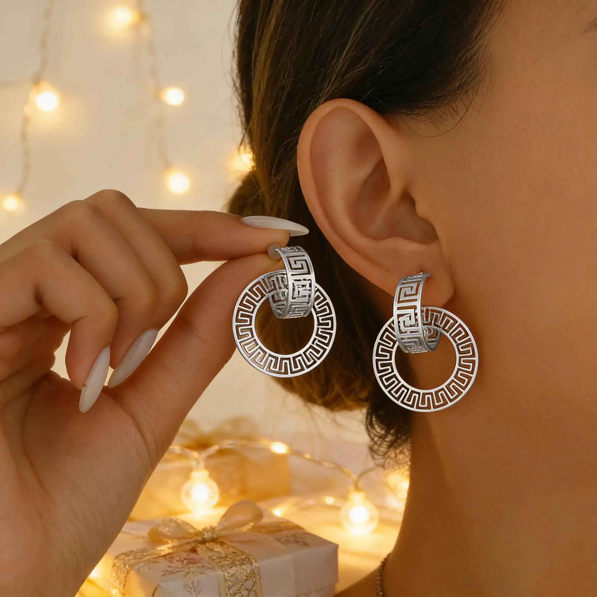 A pair of Greek style silver patterned circular earrings with retro hollow out design, designed to enhance face shape, suitable for wearing at parties and festivals.