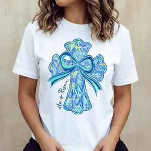 Casual Cotton Round Neck Short Sleeve Summer T Shirt Featuring Vibrant Cross and Bow Design He Is Risen Printed Graphic for Easy Machine Washings Made in USA Unique Christian Easter Graphic Tee