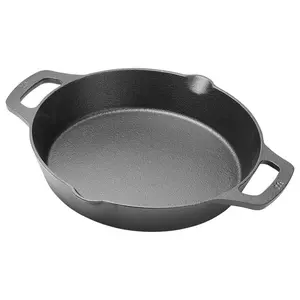 10.25 Cast Iron Skillet; This round cast iron pre-seasoned induction skillet features a 10.25 in. diameter and is designed for versatile cooking and elegant kitchen-to-table service.