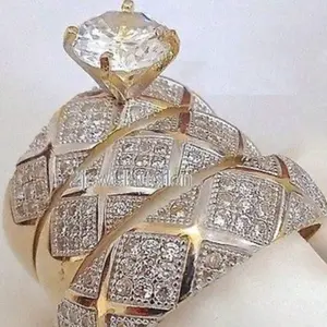 A set of three minimalist wedding/engagement rings, 14K gold plated, set with sparkling Zirconia stones. Jewelry for women.