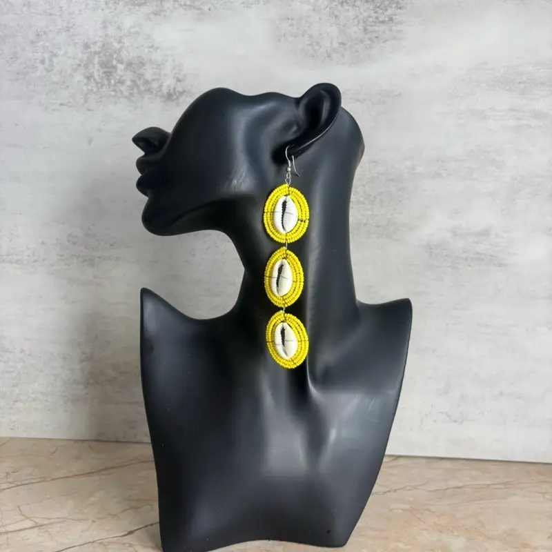28/YELLOW: Afrocentric 100% handmade natural cowries earrings pair with Clay beads. These earrings are crafted by West African artisans to celebrate and showcase beauty and heritage .