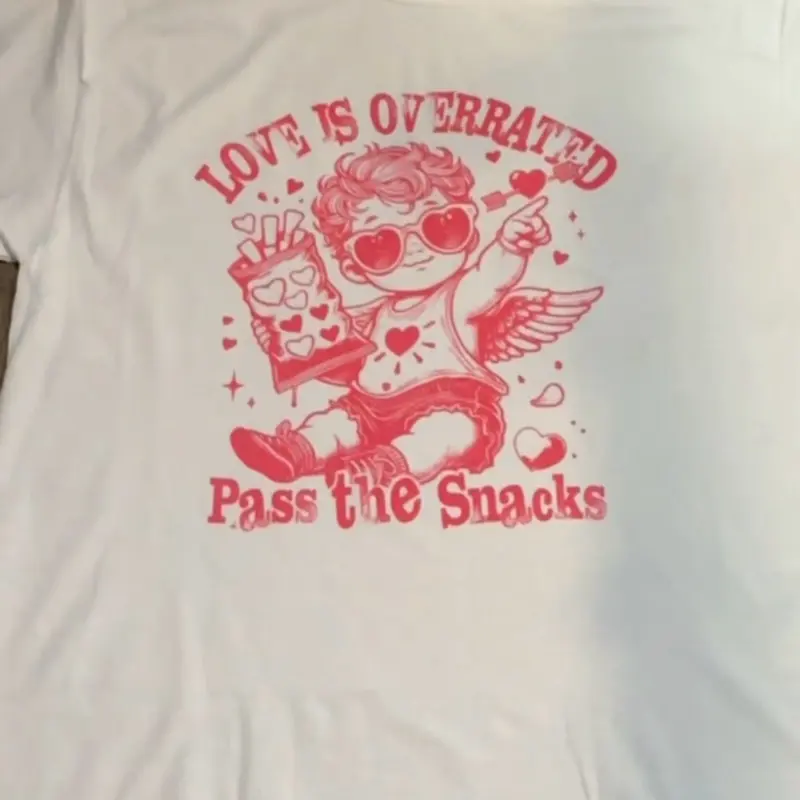 Love is over rated pass the snacks tee Love is over rated pass the snacks tee