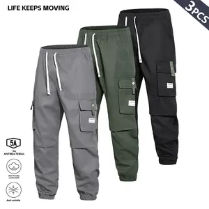 Men’s cargo pants with multiple pockets and a drawstring waist, street style, regular fit, casual and comfortable, elastic waistband, durable fabric—men’s bottoms suitable for outdoor leisure travel in all four seasons.