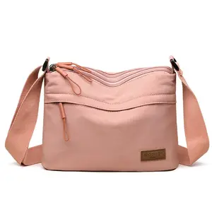 Lightweight, multi-layered, large-capacity nylon bag for women; a casual, waterproof, portable, and stylish small square shoulder/crossbody bag.