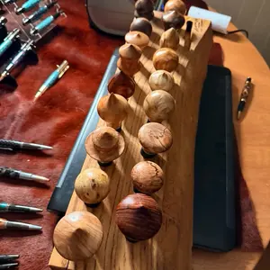 Pick your hand turned bottle stopper. Stopper selected will be shipped. Wine and liquor stainless steel bases. Price per stopper will be bid on basically. Once payment is verified topper will be tagged and shipped