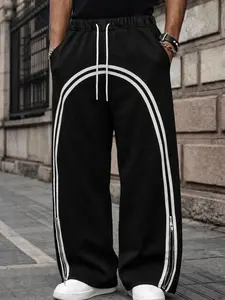 Unisex Y2K loose-fit sweatpants featuring a white curved stripe pattern; color-block stripes paired with a zip-bottom hem; made from heavy cotton fabric with reinforced stitching; skin-friendly material suitable for various occasions, creating a street-co